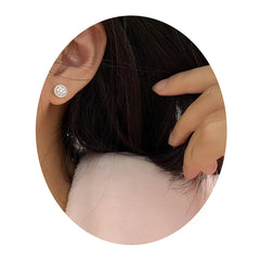Dainty Round Cubic Zirconia Stud Earrings for Women | Classic White CZ Push-Back Earri close-up view