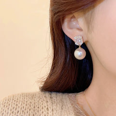 Gold Tone Pearl Drop Earrings | Shiny Crystal Pendant Jewelry detail view