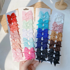 10Pcs/Set Solid Color Kids Bows Hair Clips for Baby Girls Handmade Ribbon Bowknot Hair close-up view