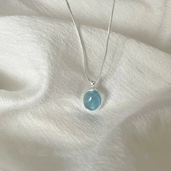 Oval Aquamarine Pendant Necklace | Snake Chain Jewelry for Women close-up view