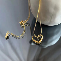 ANENJERY Stainless Steel Twist Hollow Heart Pendant Necklace | Trendy Clavicle Chain f close-up view
