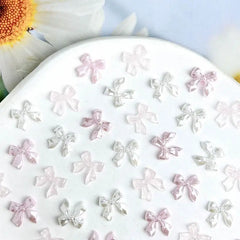 50pcs 3D Sweet Pearly Glossy Ribbon Bow Resin Nail Charms Ballerina Bow Tie Nail Art D close-up view