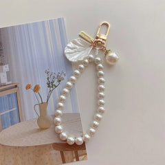 ZAKOL Cute Pearl Keychain for Women Girls Shiny Pearl Bead Shell Phone Bag Backpack Ch close-up view