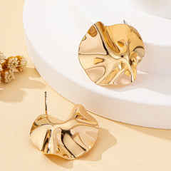 A Pair of Irregular Round Metal Stud Earrings Jewelry detail view