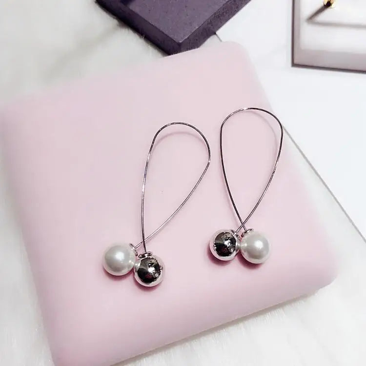 Wild Simple Pearl Bean Earrings lifestyle view
