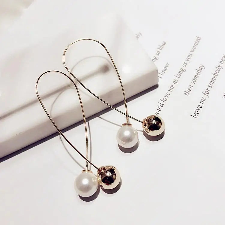 Wild Simple Pearl Bean Earrings close-up view