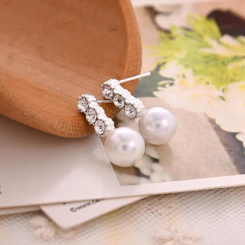 Wild Simple Pearl Bean Earrings lifestyle view