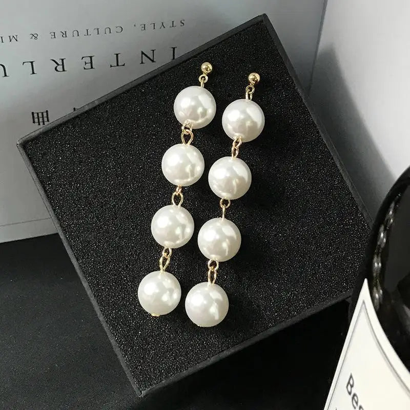 Wild Simple Pearl Bean Earrings detail view