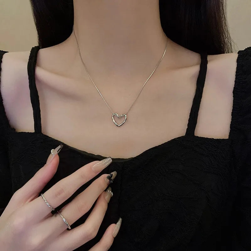 ANENJERY Stainless Steel Twist Hollow Heart Pendant Necklace | Trendy Clavicle Chain lifestyle view