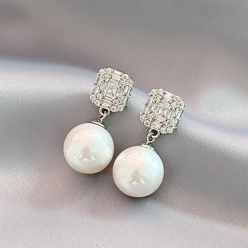 Gold Tone Pearl Drop Earrings | Shiny Crystal Pendant Jewelry lifestyle view