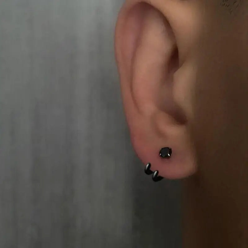 2023 New Simple Zircon Stud Earrings Single Trend Personality Hip-hop Niche Hook Shape close-up view