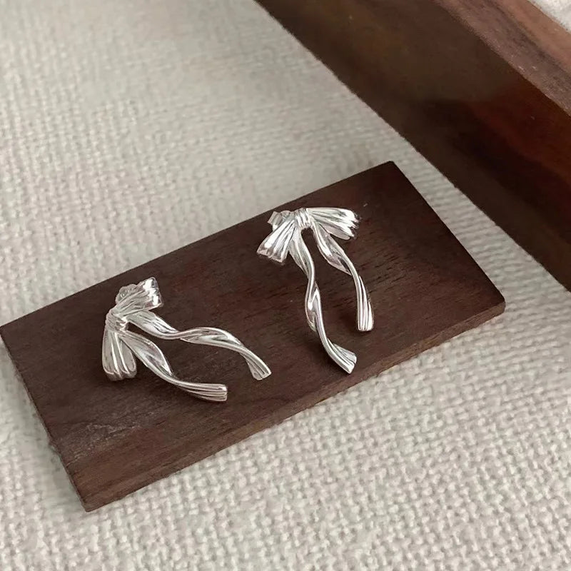 PANJBJ 925 Sterling Silver Bow Knot Earring for Women Texture Tassels Sweet Romantic lifestyle view