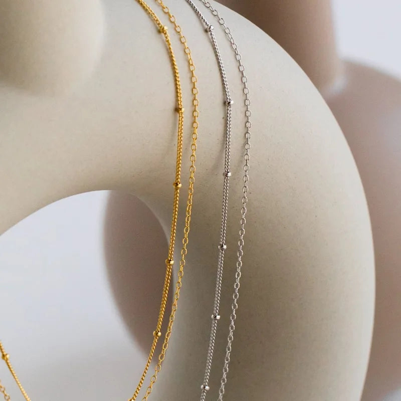Dainty Gold Layered Bead Chain Necklace | Stainless Steel Star Pendant Jewelry close-up view