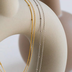 Dainty Gold Layered Bead Chain Necklace | Stainless Steel Star Pendant Jewelry close-up view