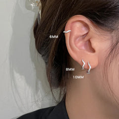 Stainless Steel Minimal Wave Hoop Earrings Crystal Zirconia Small Huggie Thin Cartilag close-up view