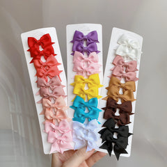 10Pcs/Set Solid Color Kids Bows Hair Clips for Baby Girls Handmade Ribbon Bowknot Hair close-up view