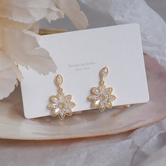 14K Real Gold Dainty Korean Flower Earrings for Women | Bling AAA Zirconia Stud Earrin close-up view