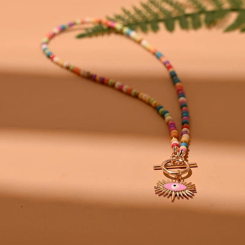 Colorful Stone Choker Necklace | Round Evil Charm Pendant for Women close-up view