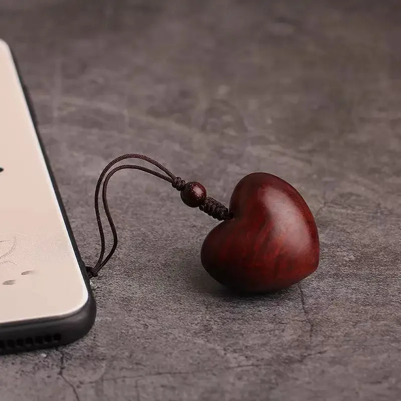 Creative Simple Rosewood Red Love Keychain | Hand-woven Solid Wood Phone Charm for Cou close-up view