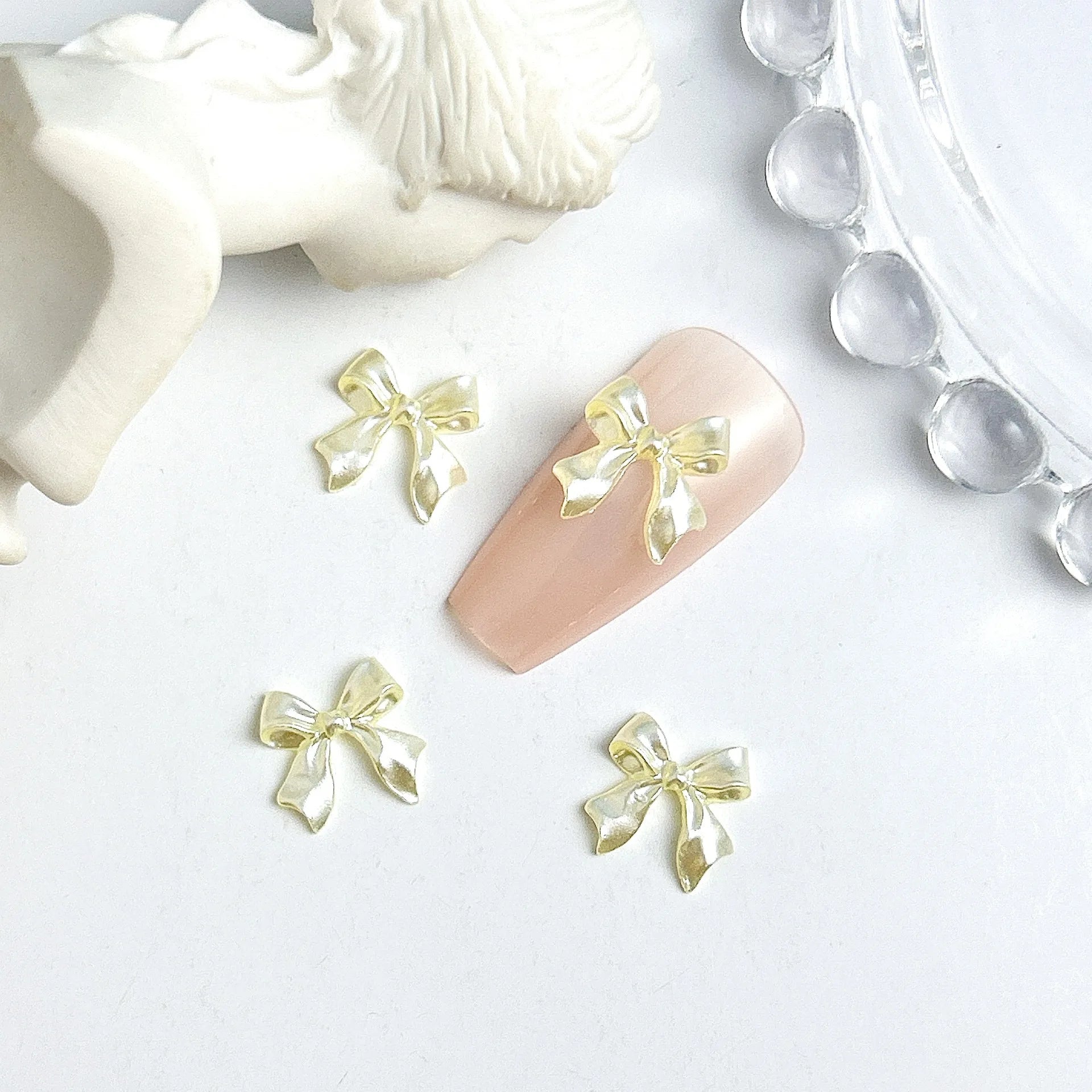 50pcs 3D Sweet Pearly Glossy Ribbon Bow Resin Nail Charms Ballerina Bow Tie Nail Art D close-up view