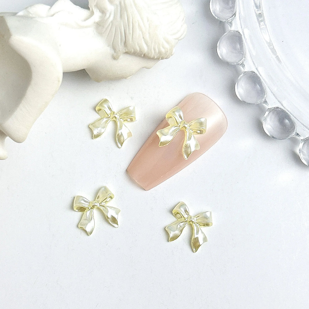 50pcs 3D Sweet Pearly Glossy Ribbon Bow Resin Nail Charms Ballerina Bow Tie Nail Art D close-up view