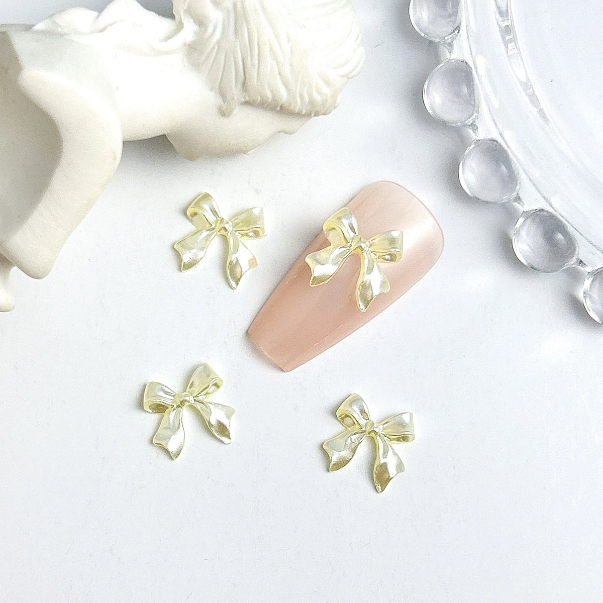 50pcs 3D Sweet Pearly Glossy Ribbon Bow Resin Nail Charms Ballerina Bow Tie Nail Art D close-up view
