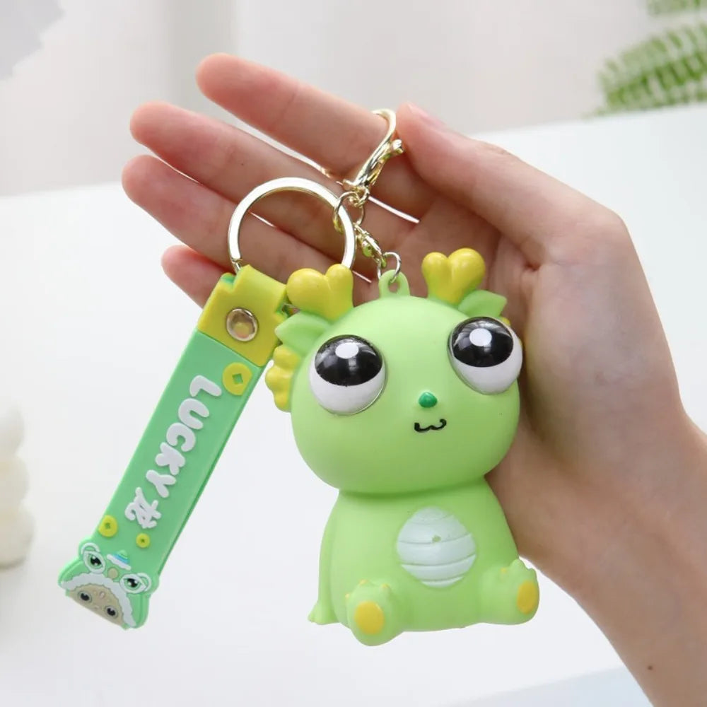 Big Eyed Dragon Squishy Toy | Pop Eyes Fidget Keychain for Stress Relief detail view