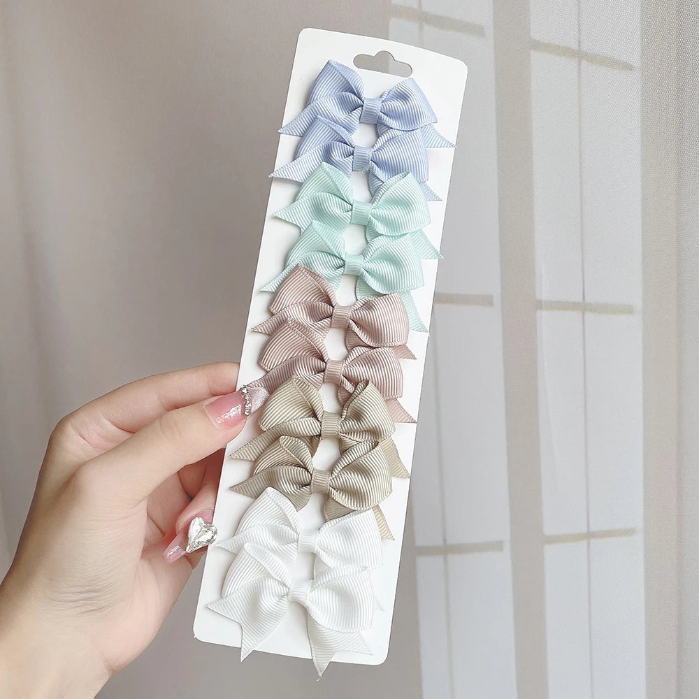 10Pcs/Set Solid Color Kids Bows Hair Clips for Baby Girls Handmade Ribbon Bowknot Hair close-up view