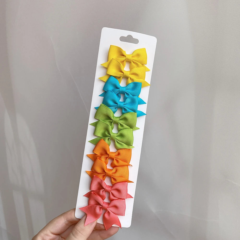 10Pcs/Set Solid Color Kids Bows Hair Clips for Baby Girls Handmade Ribbon Bowknot Hair close-up view