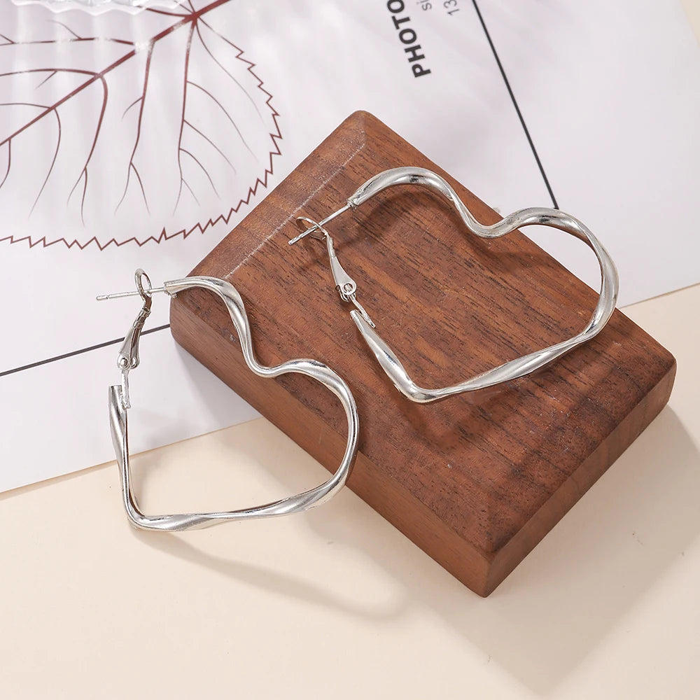 Trendy Hollow Heart Earring Cuff | Fashion Hoop Earrings for Women additional angle