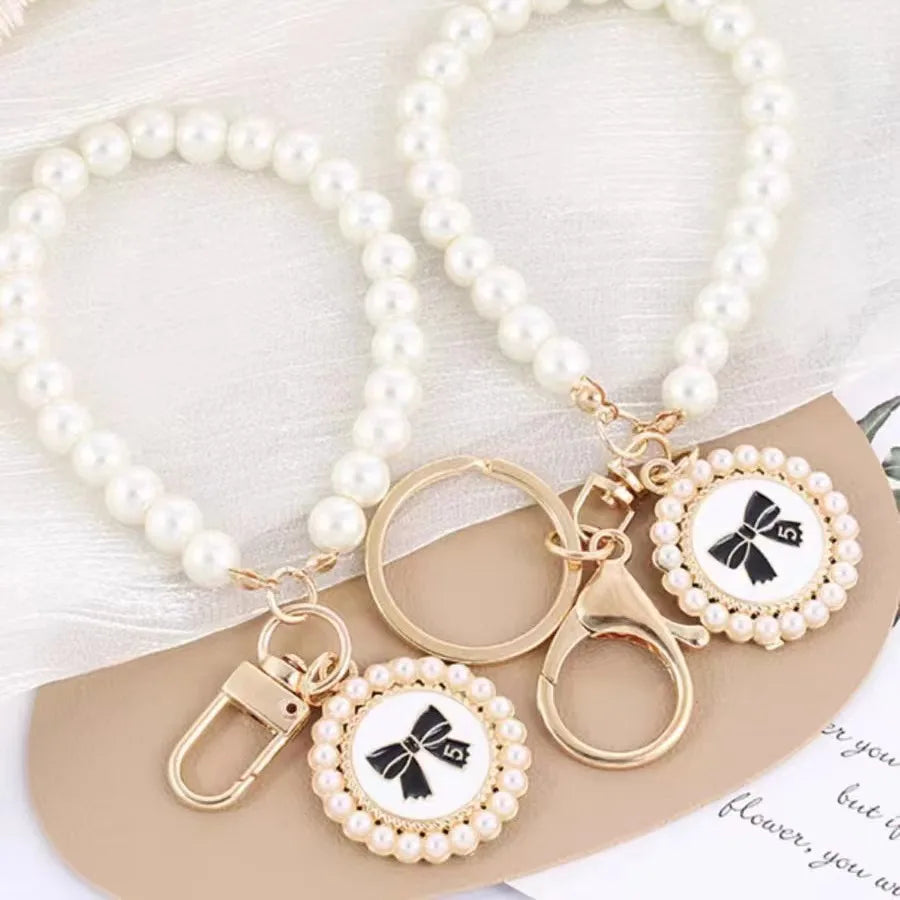 ZAKOL Cute Pearl Keychain for Women Girls Shiny Pearl Bead Shell Phone Bag Backpack Ch close-up view