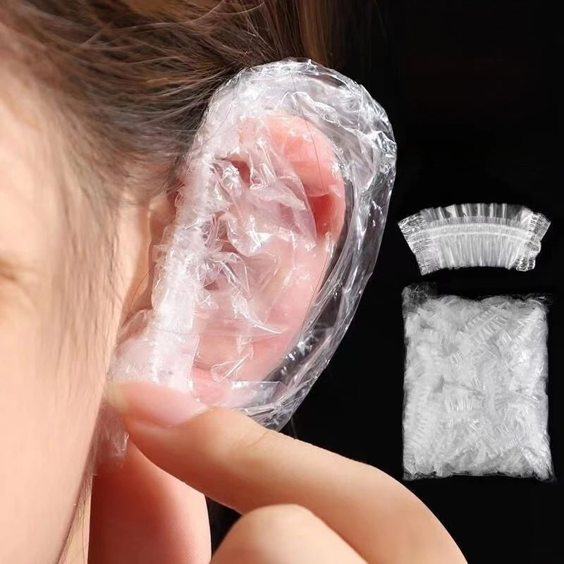 100Pcs Disposable Waterproof Ear Cover Hair Dye Earmuff Shower Bathing Baking Oil Barb close-up view