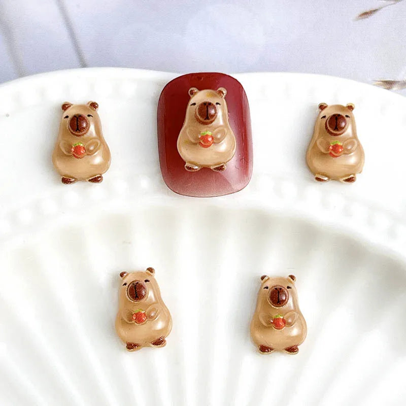 50Pcs Cartoon Cute Resin Capybara Nail Charms Creative Hamster Animal Nail Art Decorat close-up view