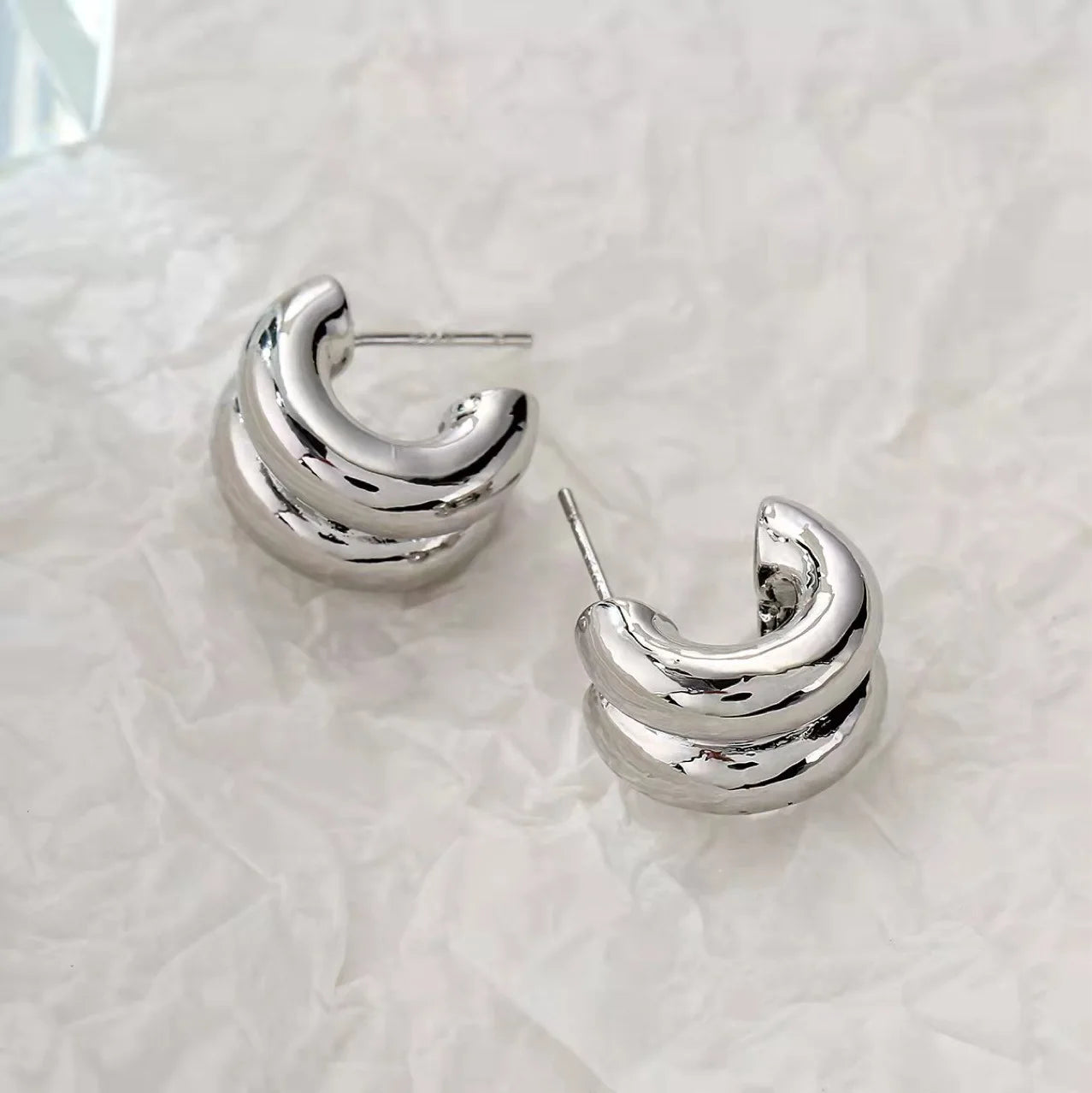 CARLIDANA Connected Double Ring CC Shape Gold Earrings | Stainless Steel PVD Gold Plat close-up view