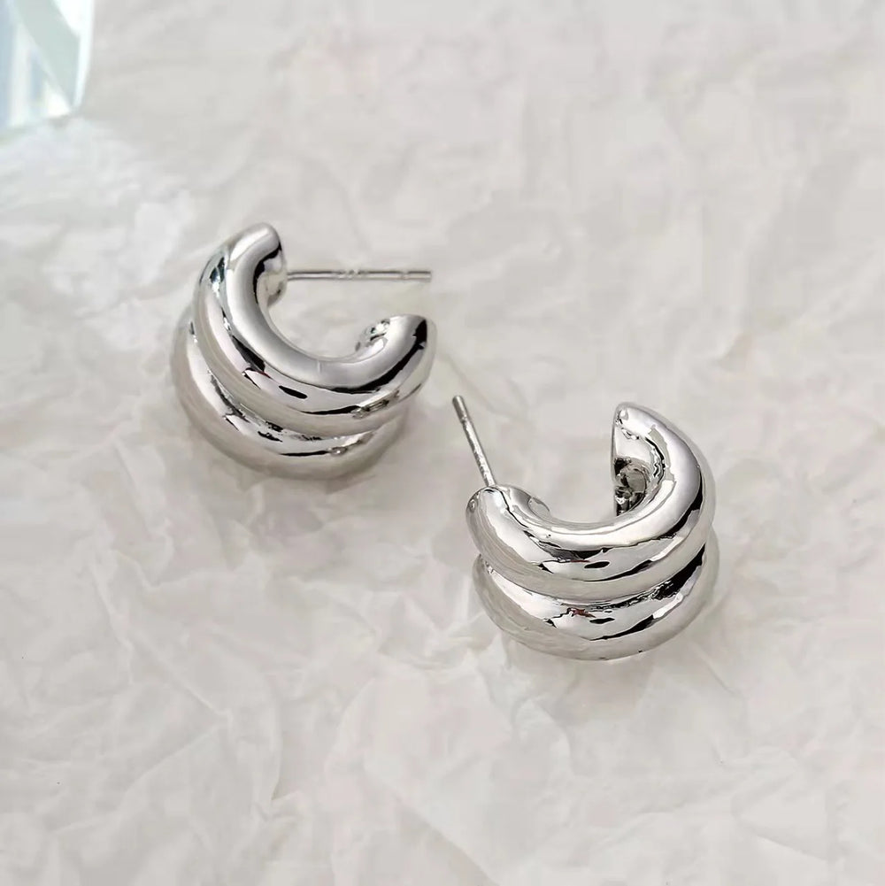 CARLIDANA Connected Double Ring CC Shape Gold Earrings | Stainless Steel PVD Gold Plat close-up view