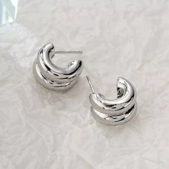 CARLIDANA Connected Double Ring CC Shape Gold Earrings | Stainless Steel PVD Gold Plat close-up view