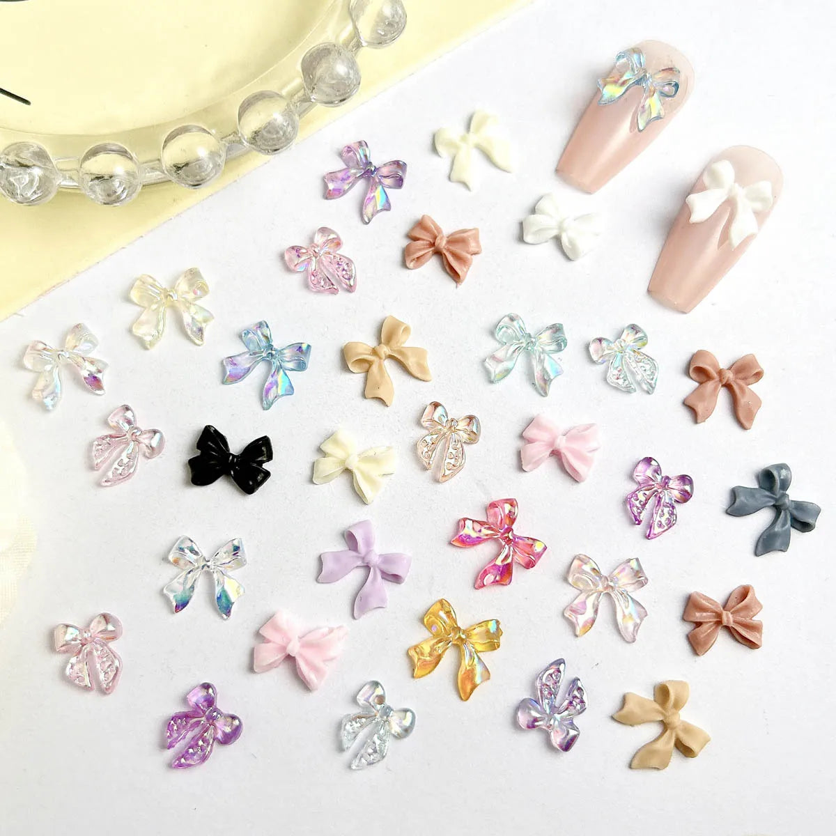50pcs 3D Sweet Pearly Glossy Ribbon Bow Resin Nail Charms Ballerina Bow Tie Nail Art D close-up view