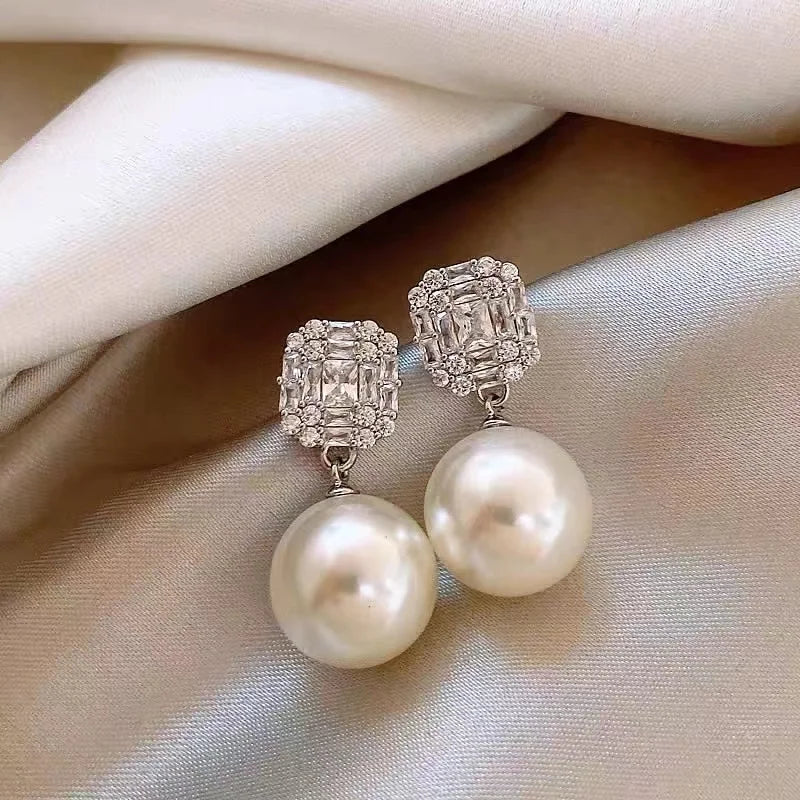 Gold Tone Pearl Drop Earrings | Shiny Crystal Pendant Jewelry detail view