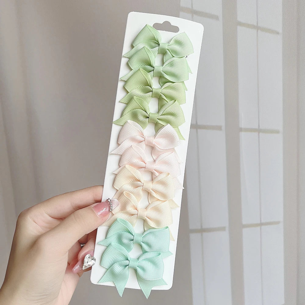 10Pcs/Set Solid Color Kids Bows Hair Clips for Baby Girls Handmade Ribbon Bowknot Hair close-up view