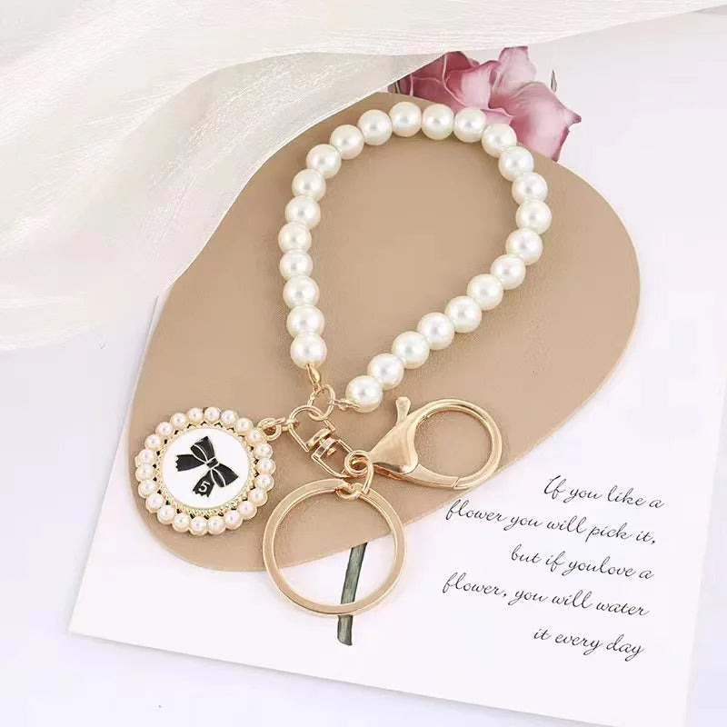 ZAKOL Cute Pearl Keychain for Women Girls Shiny Pearl Bead Shell Phone Bag Backpack Char detail view