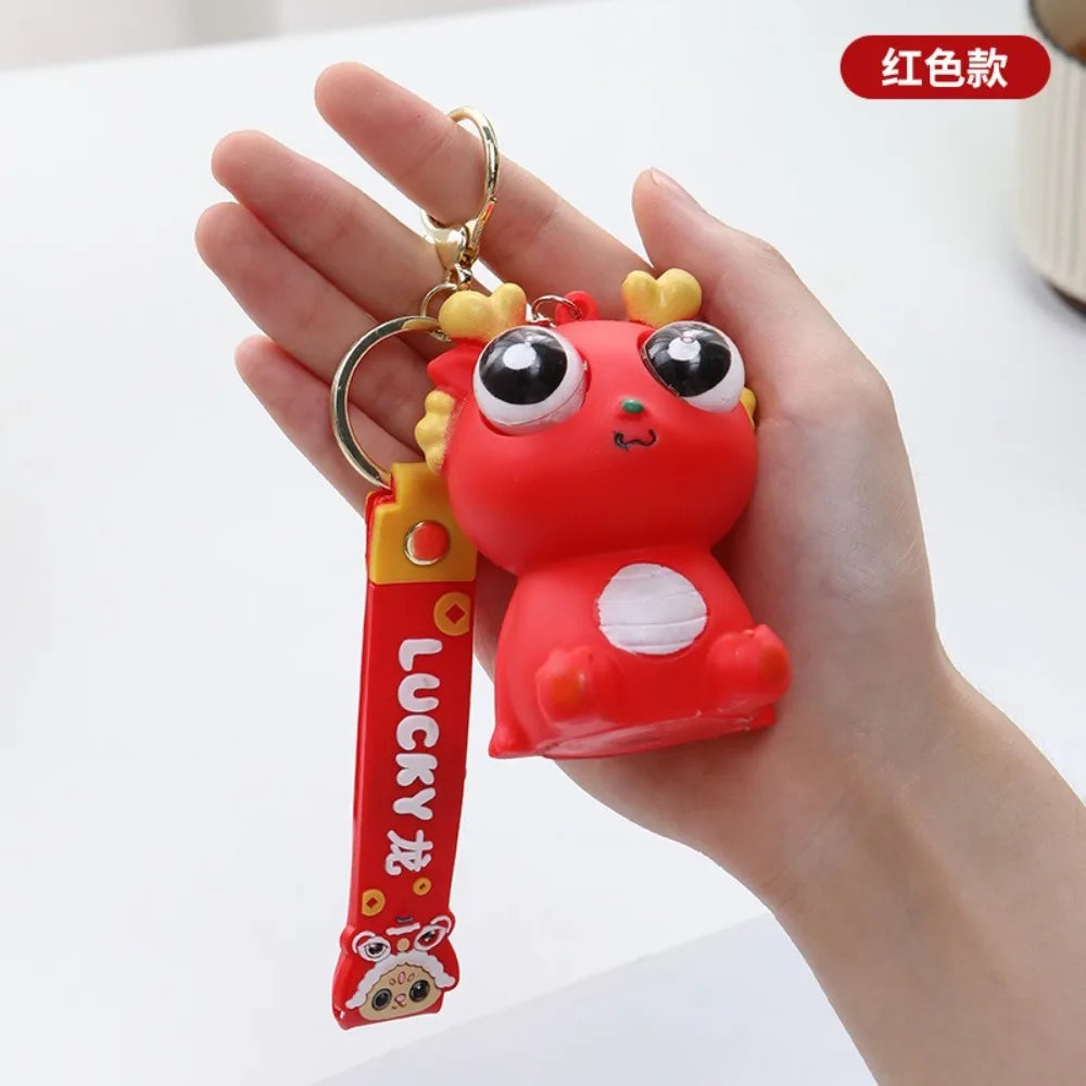 Big Eyed Dragon Squishy Toy | Pop Eyes Fidget Keychain for Stress Relief close-up view