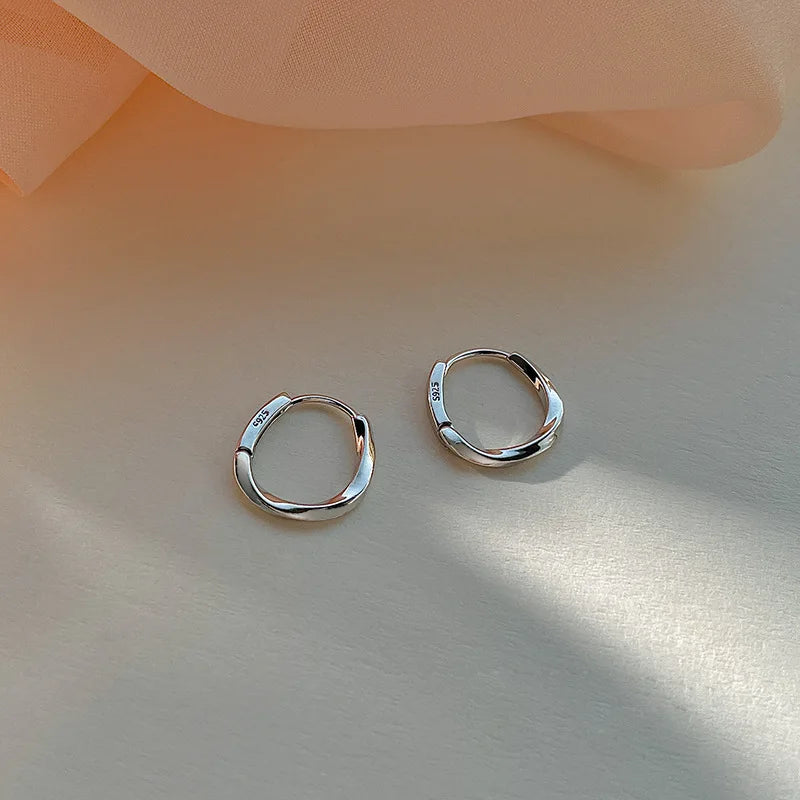 Silver Hoop Earrings | Trendy Distorted Round Earrings for Women additional angle