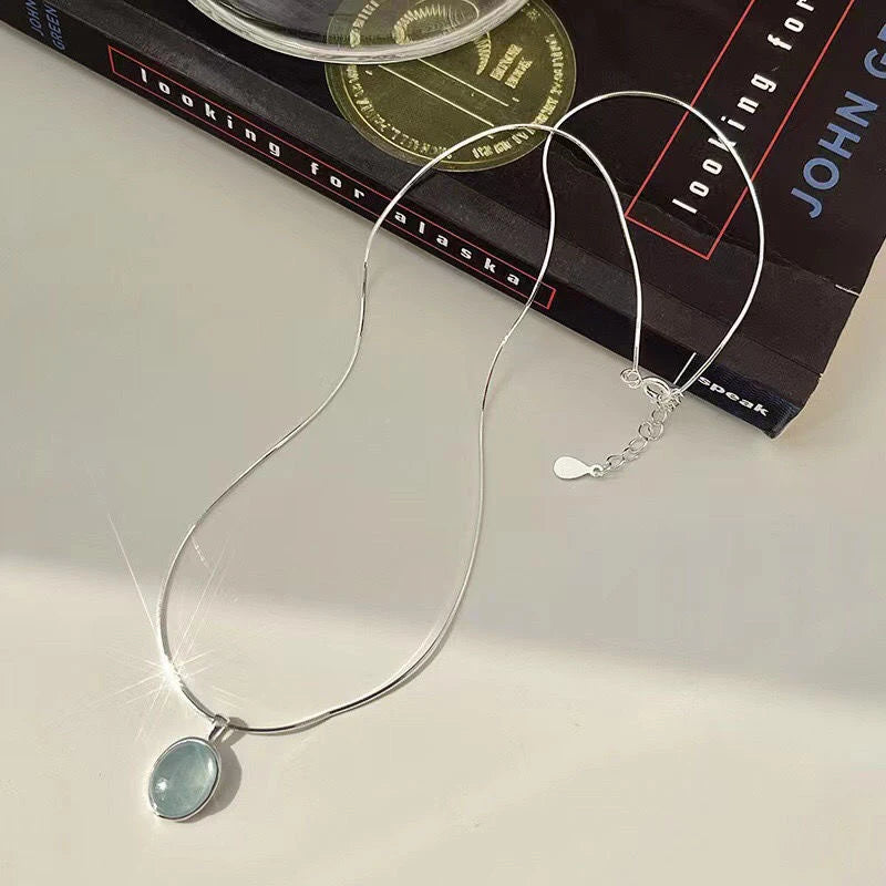 Oval Aquamarine Pendant Necklace | Snake Chain Jewelry for Women lifestyle view