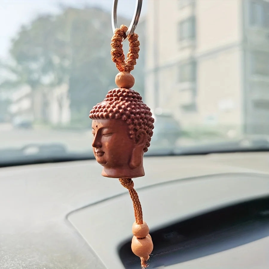Buddha Head Carved Wood Keychain | Peach Wood Key Ring lifestyle view
