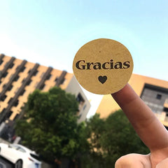 Kraft Gracias Spanish Thank You Sticker Seals | 1 Inch Envelope Stickers close-up view