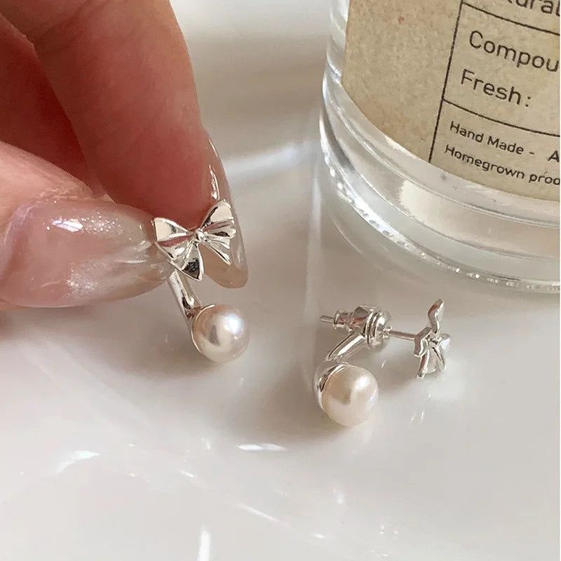 PANJBJ 925 Sterling Silver Bow Knot Earring for Women Texture Tassels Sweet Romantic lifestyle view