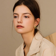 Trendy Stainless Steel Hoop Earrings for Women | Gold Plated Layered Huggie Earrings close-up view