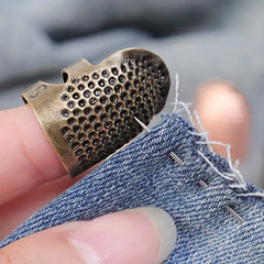 Metal Adjustable Sewing Thimble Sewing Finger Protection Cover Thimbles Cap Shield Rin close-up view