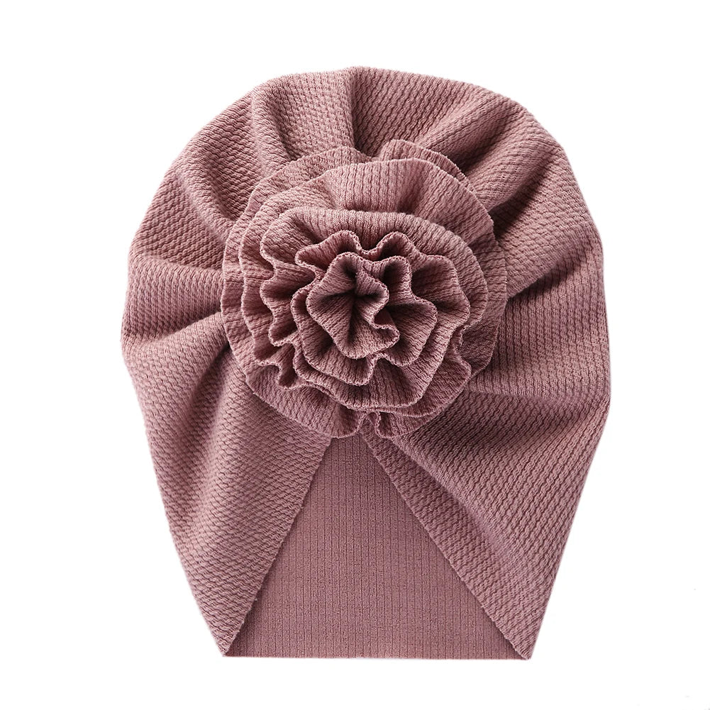 Big Blossom Flower Ribbed Turban Baby Hat | Soft Cotton Topknot Bonnet for Newborns a lifestyle view