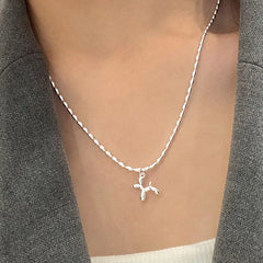Silver Balloon Dog Pendant Necklace | Cute Animal Charm Jewelry close-up view
